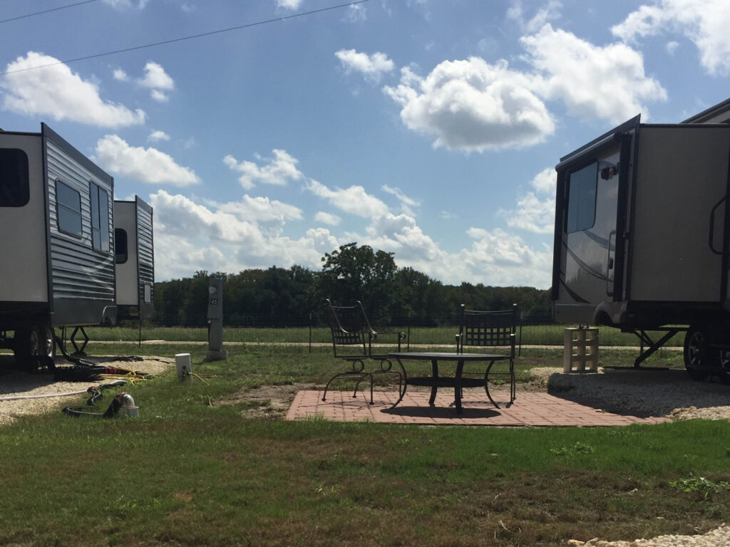 rv sites at Country Oasis RV Park in Georgetown TX RV patio area with picnic table and chairs at Country Oasis RV Park